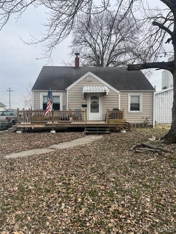 308 S Cedar St, Trenton, IL 62293 - view of front of home with a wooden deck and a chimney