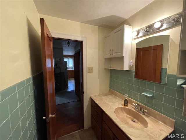 308 S Cedar St, Trenton, IL 62293 - bathroom featuring vanity, tile walls, and a wainscoted wall
