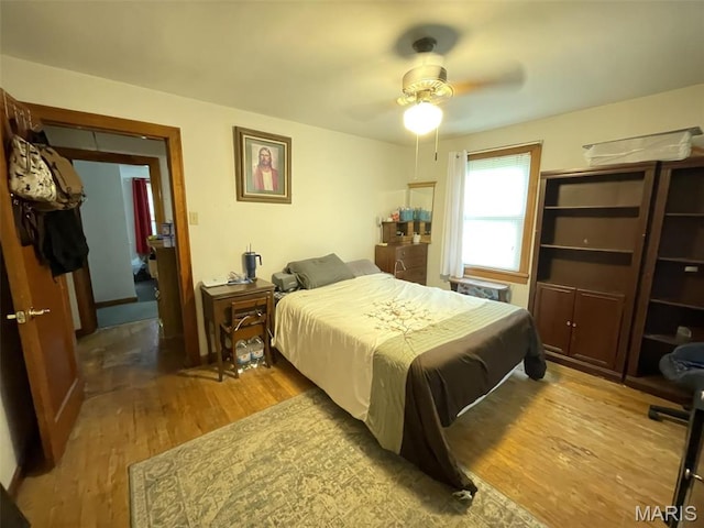 308 S Cedar St, Trenton, IL 62293 - bedroom with light wood-style floors and a ceiling fan