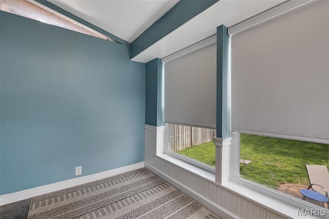 5245 Robert Ave, Saint Louis, MO 63109 - spare room with vaulted ceiling, carpet, and baseboards