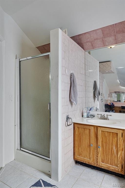 5245 Robert Ave, Saint Louis, MO 63109 - bathroom with tile patterned flooring, a shower stall, lofted ceiling, and vanity