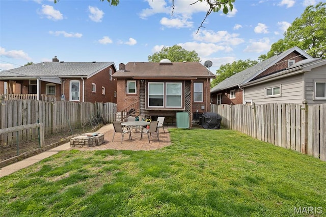 5245 Robert Ave, Saint Louis, MO 63109 - rear view of property featuring a patio, an outdoor fire pit, and brick siding