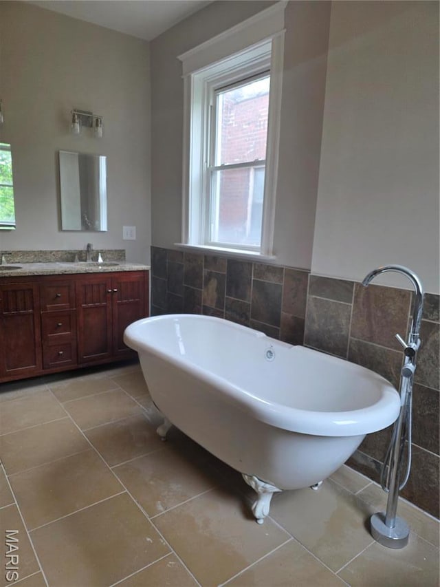 5614 Etzel Ave, Saint Louis, MO 63112 - full bathroom with tile walls, vanity, healthy amount of natural light, and tile patterned flooring