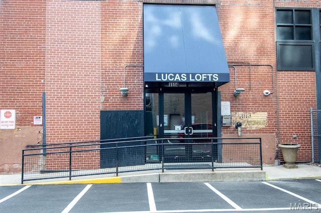 1113 Washington Ave Unit 312, Saint Louis, MO 63101 - property entrance with uncovered parking and brick siding