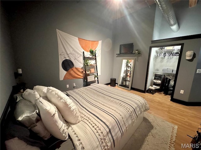 1113 Washington Ave Unit 312, Saint Louis, MO 63101 - bedroom with light wood-style floors and baseboards
