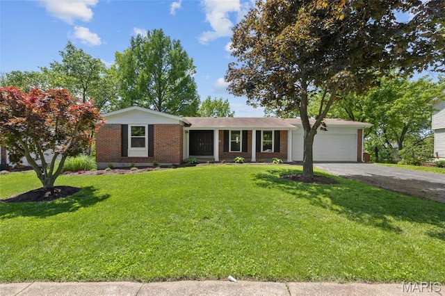 1200 Auber Dr, Manchester, MO 63011 - single story home with a garage, asphalt driveway, brick siding, and a front lawn