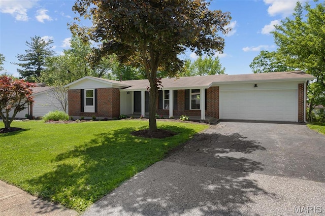 1200 Auber Dr, Manchester, MO 63011 - ranch-style home featuring driveway, brick siding, a garage, and a front yard