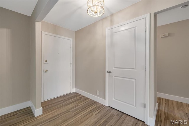 1200 Auber Dr, Manchester, MO 63011 - entrance foyer featuring wood finished floors, baseboards, and a chandelier