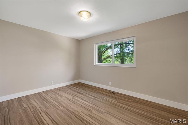 1200 Auber Dr, Manchester, MO 63011 - spare room with baseboards and wood finished floors