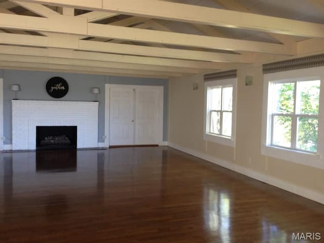 1200 Auber Dr, Manchester, MO 63011 - unfurnished living room featuring baseboards, wood finished floors, and a brick fireplace