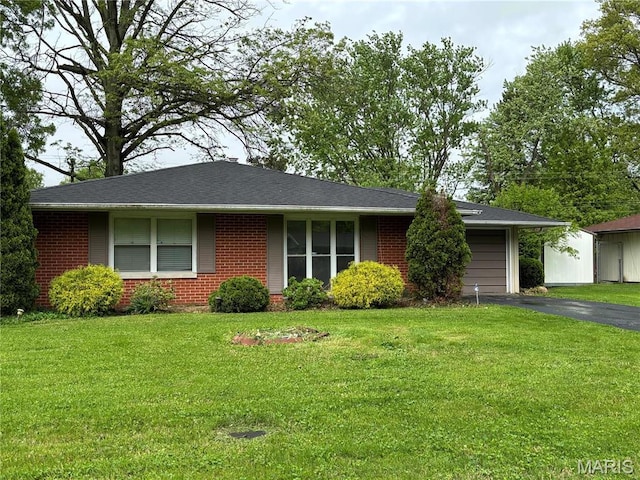 213 Todd Ln, Belleville, IL 62221 - ranch-style home with brick siding, driveway, a garage, and a front lawn