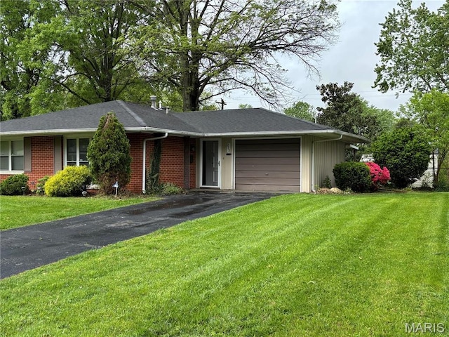 213 Todd Ln, Belleville, IL 62221 - ranch-style home with driveway, an attached garage, brick siding, and a front lawn