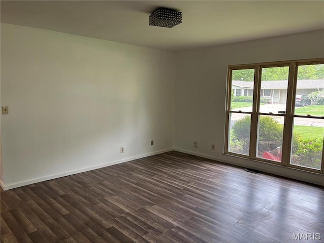 213 Todd Ln, Belleville, IL 62221 - unfurnished room featuring dark wood-type flooring and baseboards