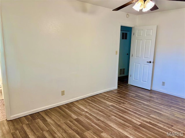 213 Todd Ln, Belleville, IL 62221 - spare room with ceiling fan, wood finished floors, and baseboards