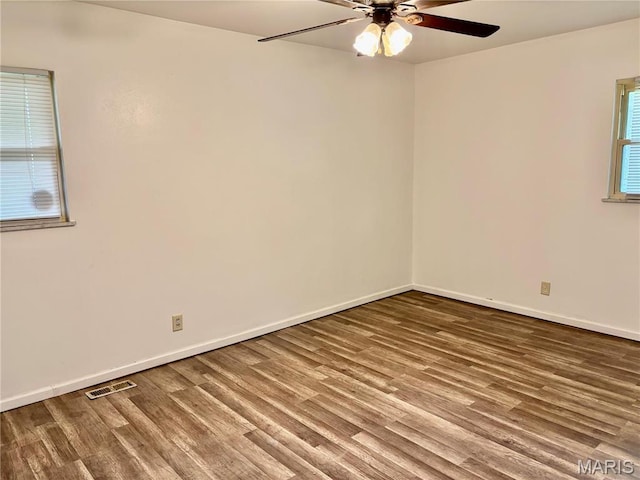 213 Todd Ln, Belleville, IL 62221 - unfurnished room featuring a ceiling fan, wood finished floors, and baseboards