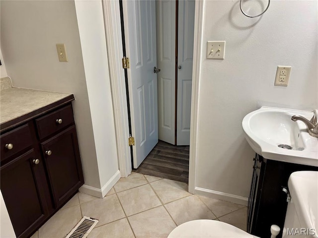 213 Todd Ln, Belleville, IL 62221 - bathroom featuring baseboards, vanity, and tile patterned flooring