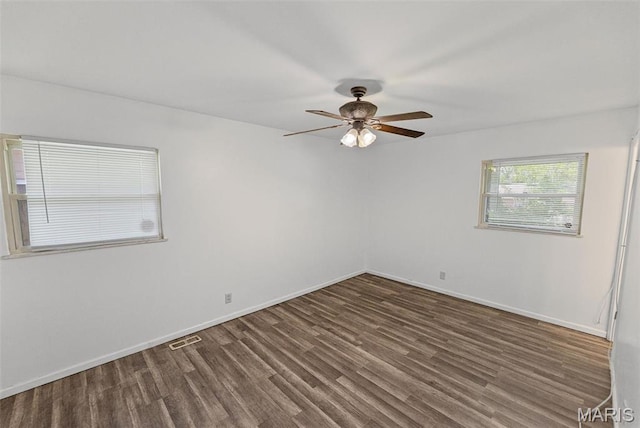 213 Todd Ln, Belleville, IL 62221 - empty room with a ceiling fan, wood finished floors, and baseboards