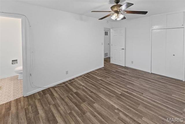213 Todd Ln, Belleville, IL 62221 - unfurnished bedroom with wood finished floors, a closet, connected bathroom, and baseboards