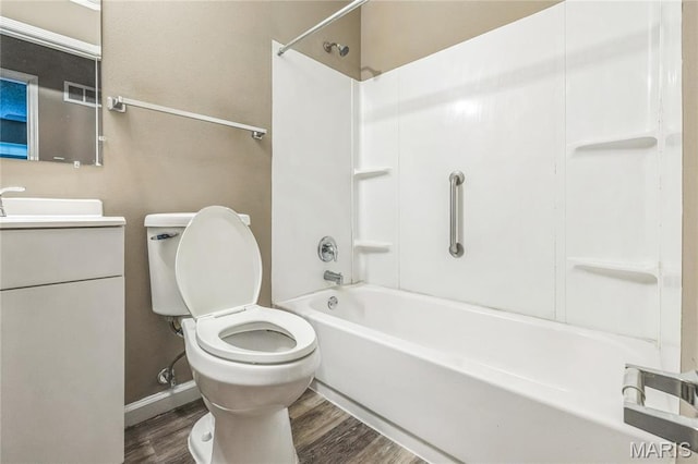 6363 Coventry Dr, Florissant, MO 63033 - bathroom with wood finished floors, shower / tub combination, toilet, and vanity