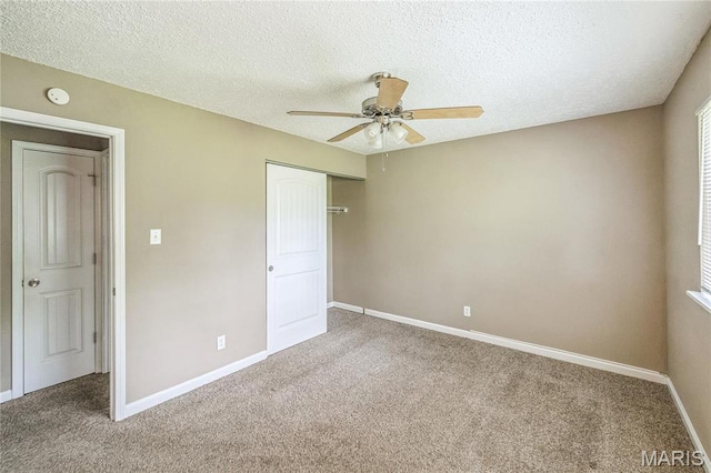 6363 Coventry Dr, Florissant, MO 63033 - unfurnished bedroom featuring carpet floors, a closet, a textured ceiling, baseboards, and a ceiling fan