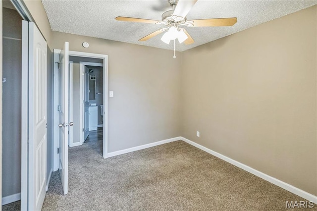6363 Coventry Dr, Florissant, MO 63033 - unfurnished bedroom featuring carpet floors, baseboards, a textured ceiling, and a closet