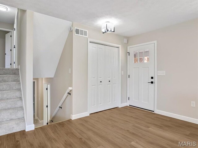 496 E 2nd St, Trenton, IL 62293 - foyer entrance with wood finished floors and baseboards