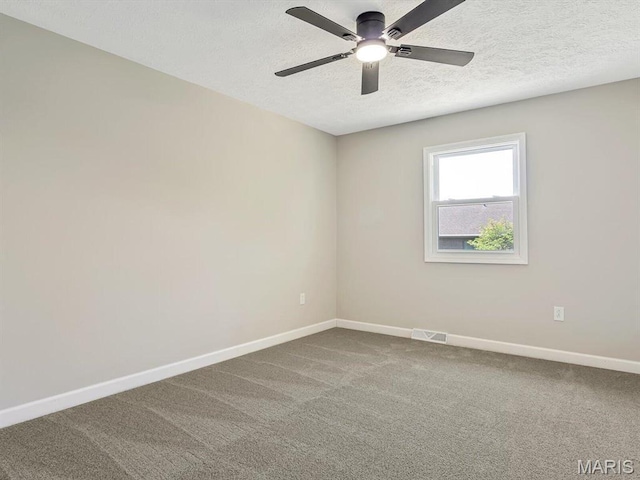 496 E 2nd St, Trenton, IL 62293 - empty room with baseboards, ceiling fan, a textured ceiling, and carpet flooring