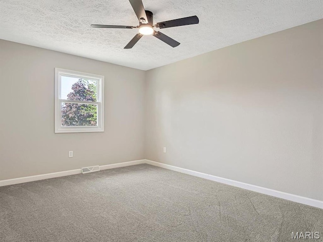 496 E 2nd St, Trenton, IL 62293 - carpeted spare room with a ceiling fan, a textured ceiling, and baseboards