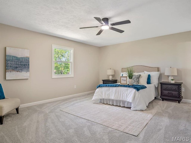 496 E 2nd St, Trenton, IL 62293 - bedroom featuring carpet floors, baseboards, ceiling fan, and a textured ceiling