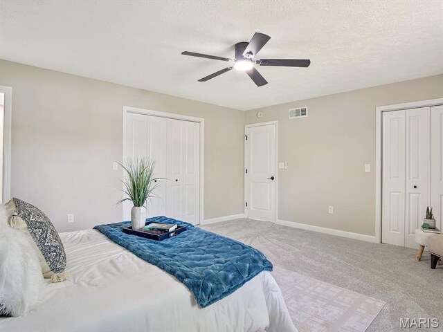 496 E 2nd St, Trenton, IL 62293 - bedroom featuring light colored carpet, baseboards, ceiling fan, and a textured ceiling