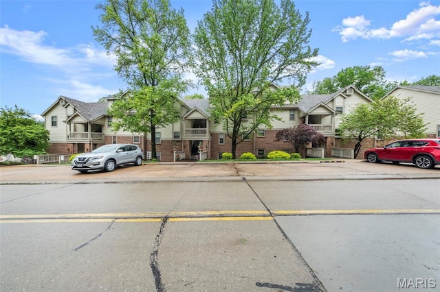 12944 Bryce Canyon Dr, Maryland Heights, MO 63043 - multi unit property with uncovered parking, a residential view, and brick siding