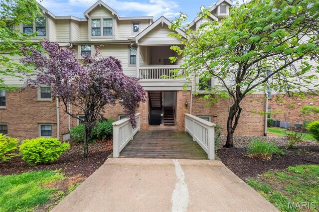 12944 Bryce Canyon Dr, Maryland Heights, MO 63043 - view of front facade featuring a balcony and brick siding
