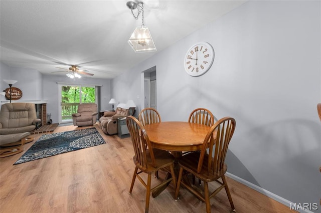 12944 Bryce Canyon Dr, Maryland Heights, MO 63043 - dining area with light wood-style floors and a ceiling fan