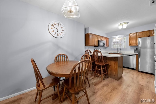 12944 Bryce Canyon Dr, Maryland Heights, MO 63043 - dining area featuring light wood-style floors