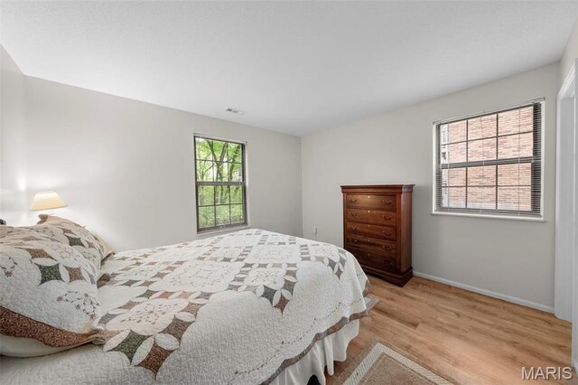 12944 Bryce Canyon Dr, Maryland Heights, MO 63043 - bedroom featuring light wood finished floors and baseboards
