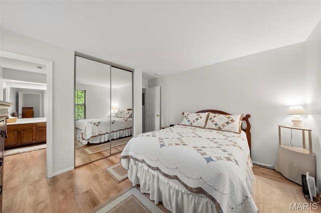12944 Bryce Canyon Dr, Maryland Heights, MO 63043 - bedroom featuring light wood finished floors and a closet