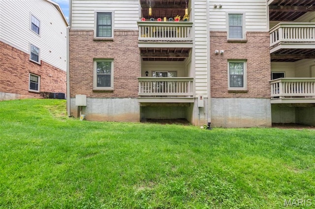 12944 Bryce Canyon Dr, Maryland Heights, MO 63043 - rear view of property with brick siding and a lawn
