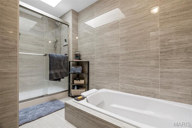 38 Trailside Ct Unit 3, Saint Charles, MO 63303 - full bath featuring a stall shower, a bath, and tile walls
