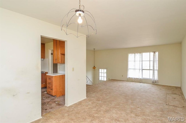 1107 Princeton Dr, Ofallon, IL 62269 - empty room featuring light carpet and a chandelier