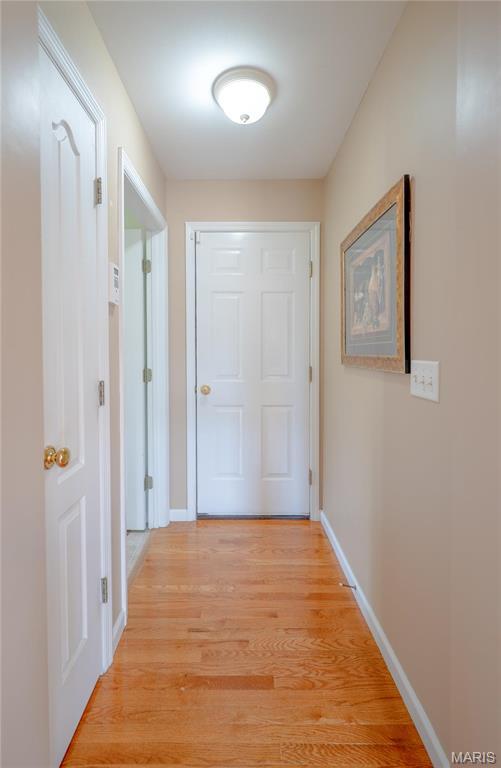 1004 Kodiak Ct, Wentzville, MO 63385 - hall with light wood-style flooring and baseboards