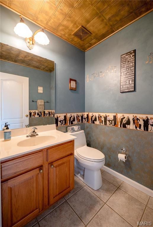 1004 Kodiak Ct, Wentzville, MO 63385 - half bathroom with an ornate ceiling, vanity, and tile patterned flooring