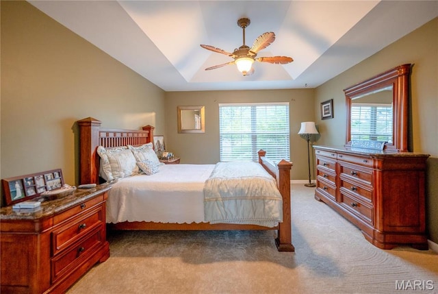 1004 Kodiak Ct, Wentzville, MO 63385 - bedroom with light carpet, a tray ceiling, and ceiling fan