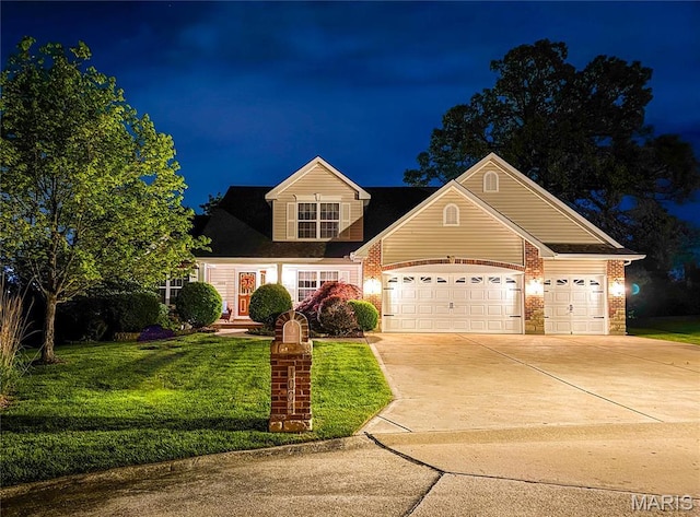1004 Kodiak Ct, Wentzville, MO 63385 - traditional-style house with driveway, a lawn, and an attached garage