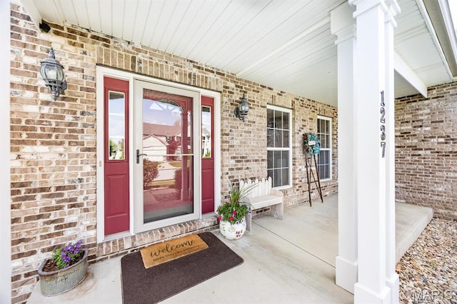 1237 Conrad Ln, Ofallon, IL 62269 - view of exterior entry with a porch and brick siding