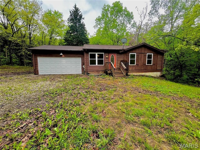 13556 Rustic Valley Dr, Wright City, MO 63390 - view of front of house with an attached garage and board and batten siding