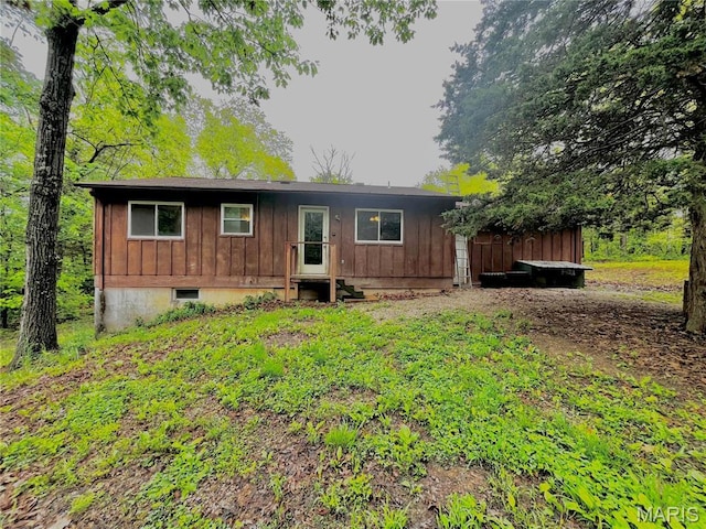 13556 Rustic Valley Dr, Wright City, MO 63390 - rear view of property featuring board and batten siding