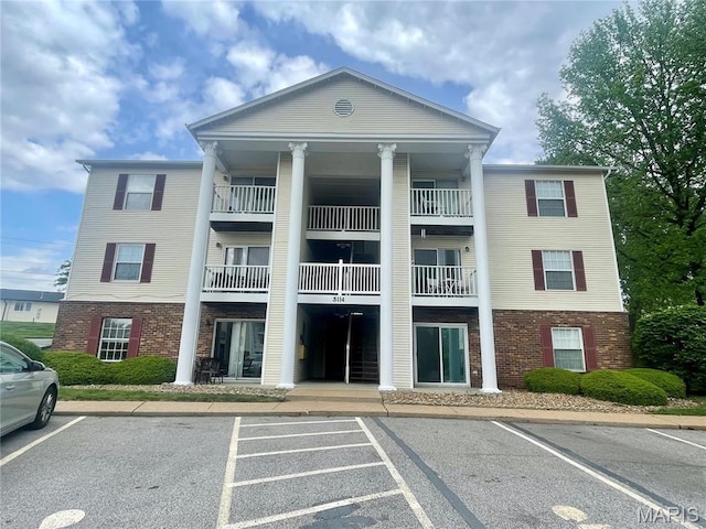 3114 Edwards Pl Unit 304, Maryland Heights, MO 63043 - view of property featuring uncovered parking