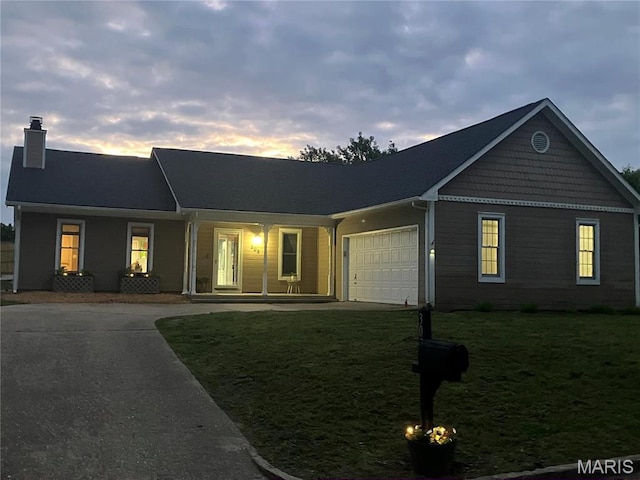 303 Greenbriar, Rolla, MO 65401 - single story home featuring a chimney, a garage, driveway, and a lawn