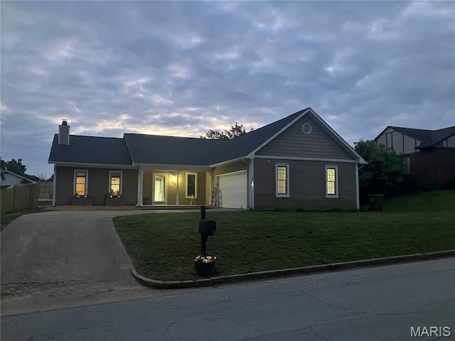 303 Greenbriar, Rolla, MO 65401 - view of front of property featuring driveway, a chimney, a yard, and a garage