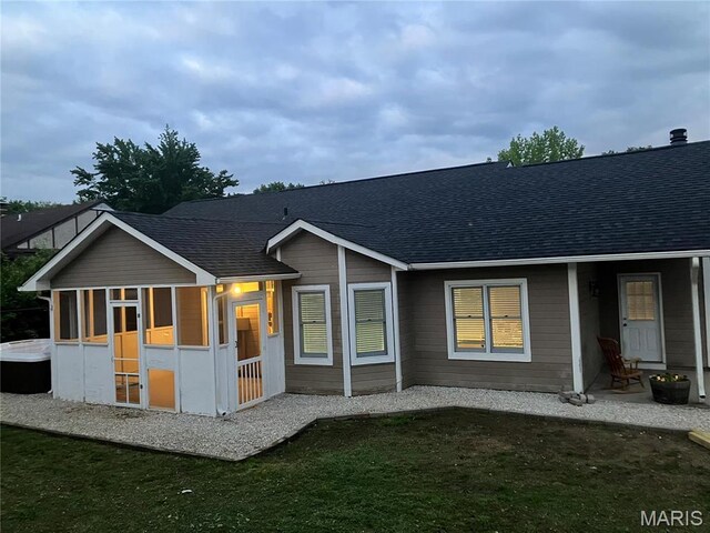 303 Greenbriar, Rolla, MO 65401 - back of property featuring a sunroom and roof with shingles